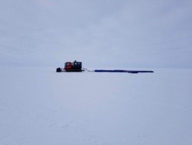 Chris pulling the radar across the ice sheet